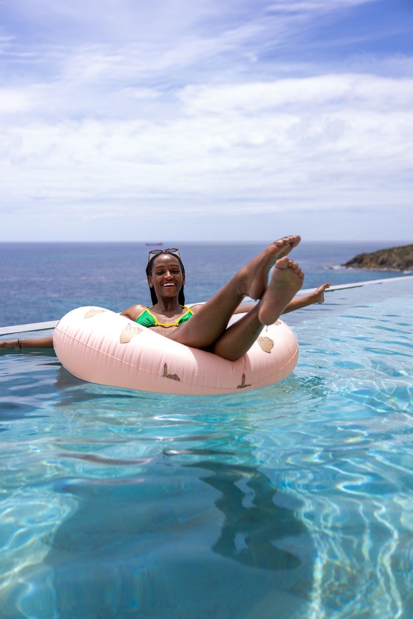 Bride relaxing poolside with a Brown Skin Bride party float